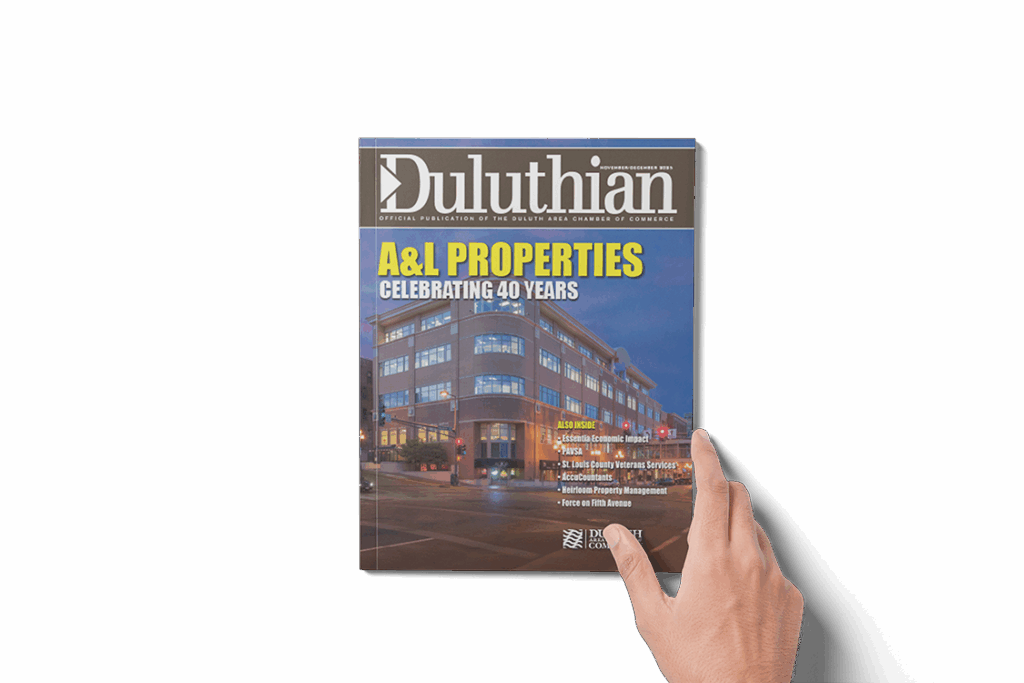 Guy a holding a Duluthian Magazine
